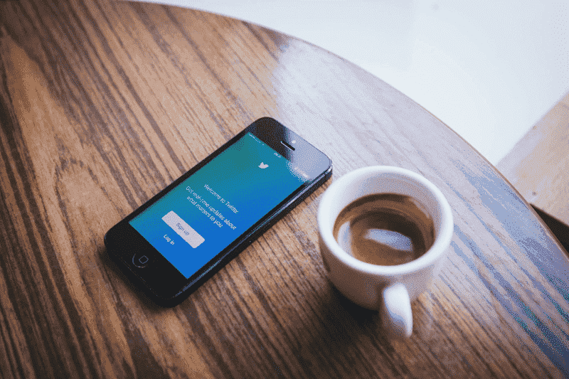 Phone and coffee on a table